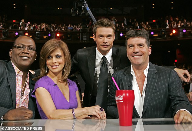 May has been in charge of production since the show's inception in 2002;  Judges Randy Jackson, Paula Abdul and Simon Cowell with host Ryan Seacrest in 2005