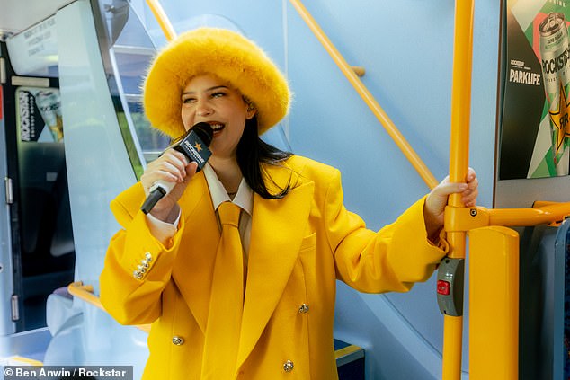 New mum Anne-Marie, 33, went back to work as she surprised fans with an impromptu performance on a bus on her way to the Rockstar Energy presents Parklife Festival in Manchester on Sunday