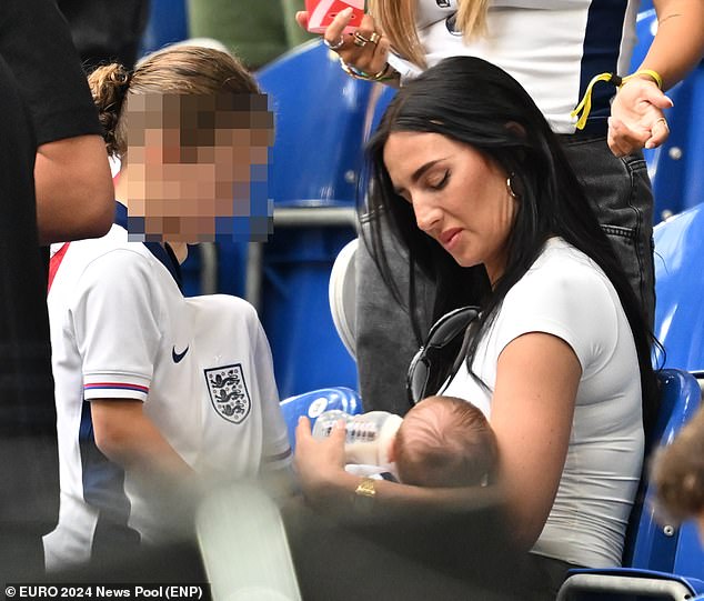 Kyle Walker's wife Annie Kilner was spotted feeding her son Rezon as she joined her fellow WAGs in the stands during the Three Lions' last 16 match on Sunday