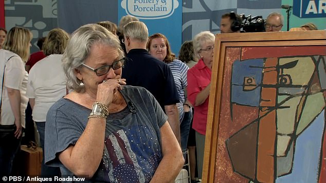 The guest in the photo cries with joy when she heard that the painting to her right, which she has had for years, could be sold for a five-figure value