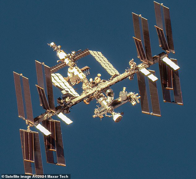 A malfunctioning Russian satellite has broken up into more than 100 pieces of spacecraft in orbit, forcing astronauts on the International Space Station (pictured) to seek shelter for about an hour and increasing the amount of space junk already in orbit, U.S. space agencies said.