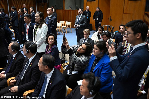 Lei (looking left) then switched seats with the woman in the blue blazer