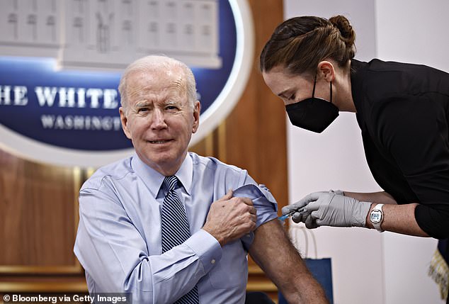 US President Joe Biden receives a booster dose of the Pfizer COVID-19 vaccine, administered by a member of the White House medical unit.  According to internal emails from Amazon employees, criticism of the White House was the 'impetus' for the company to censor vaccine books