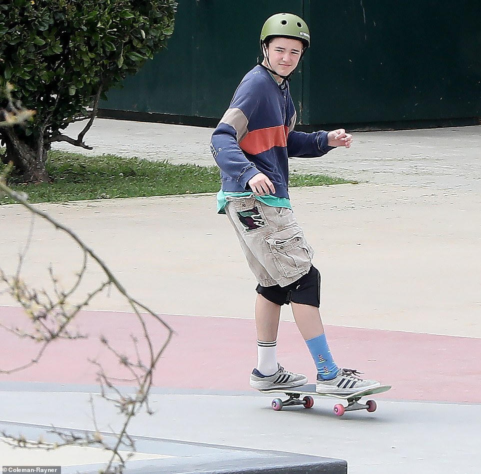 Ben Affleck's child, 15-year-old Finn (pictured), was let loose at the skate park while wearing matching socks and protective gear