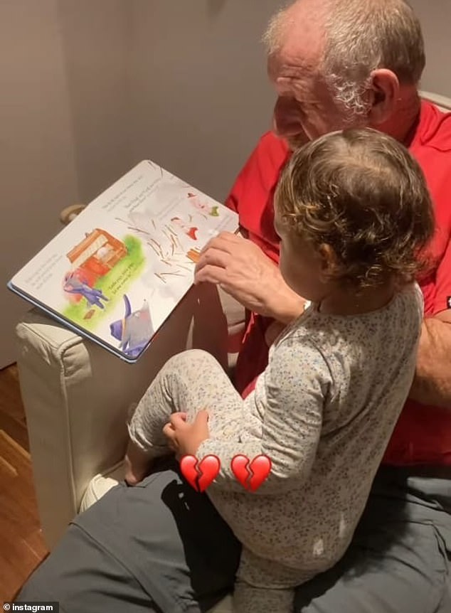 Bernard reads a bedtime story to his granddaughter