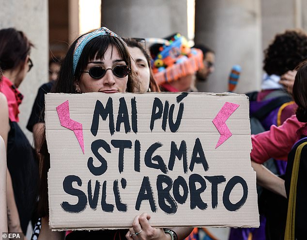 The abortion issue continues to cause controversy in the US and Europe.  An activist from the feminist and transfeminist movement 'Non una di meno' (Not one less) holds a sign reading 'no more stigma on abortion' during a demonstration for abortion rights, in Rome, Italy, May 25, 2024