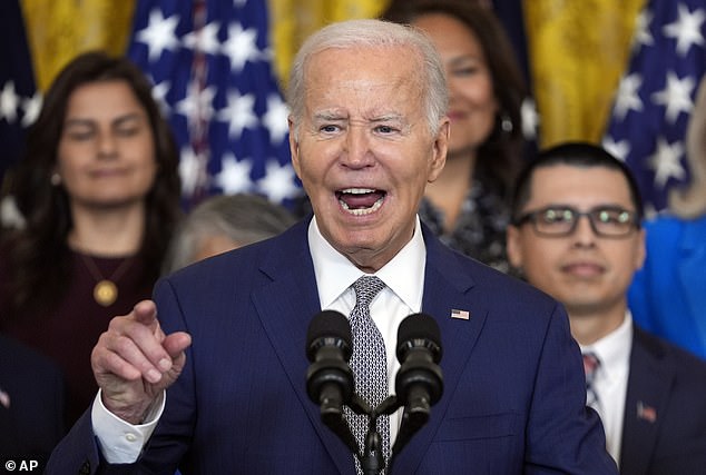 President Joe Biden speaks Tuesday at an event marking the 12th anniversary of the Deferred Action of Childhood Arrivals program in the East Room of the White House, where he announced the mass migrant amnesty for half a million spouses