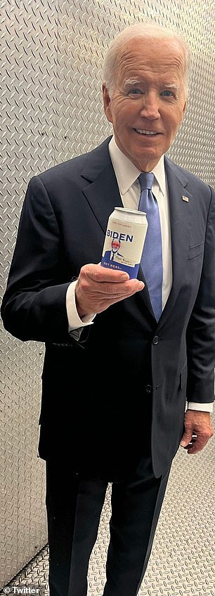Joe Biden holds a can of water