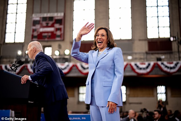 US Vice President Kamala Harris with US President Joe Biden during a campaign rally