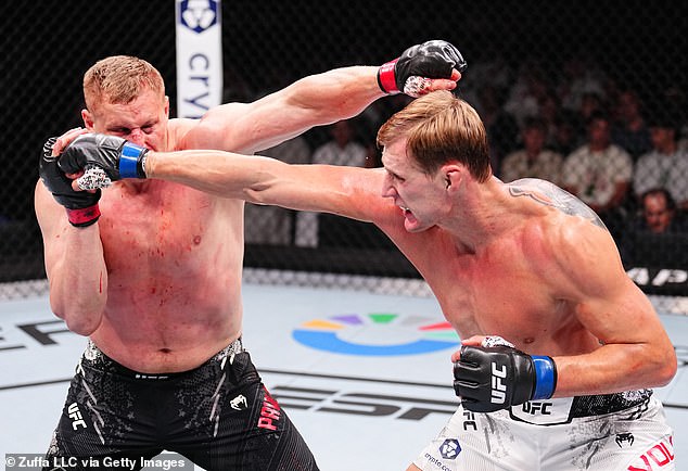 Alexander Volkov (right) and Sergei Pavlovich (left) faced off in a heavyweight fight