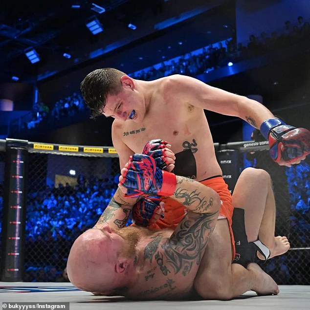 Bukovaz – pictured during a previous fight – had his hair dyed pink before popping the question