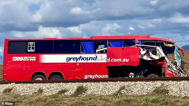 Investigators have yet to determine what caused a horrific crash between a Greyhound bus and a car pulling a caravan that left three women dead and dozens of others injured.  The photo shows the caravan in the front of the bus