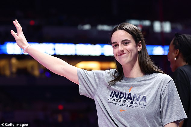 Clark waved to the crowd as she was introduced the night before at the U.S. Swimming Trials