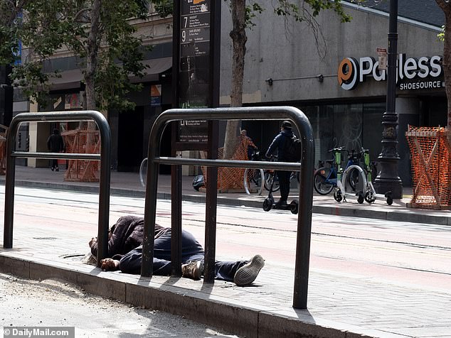 San Francisco's crime and high homelessness rates persist, especially in the surrounding downtown area and nearby Mission District.  This year, a man is seen sleeping outside the mall