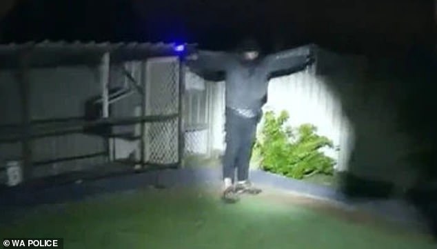 Dramatic bodycam footage has captured the moment police officers chased and arrested an armed suspect (pictured) after an alleged early morning home invasion