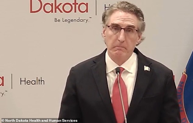 Gov. Doug Burgum fights back tears during a pandemic news conference as he calls on North Dakotans not to use masks as an ideological dividing line