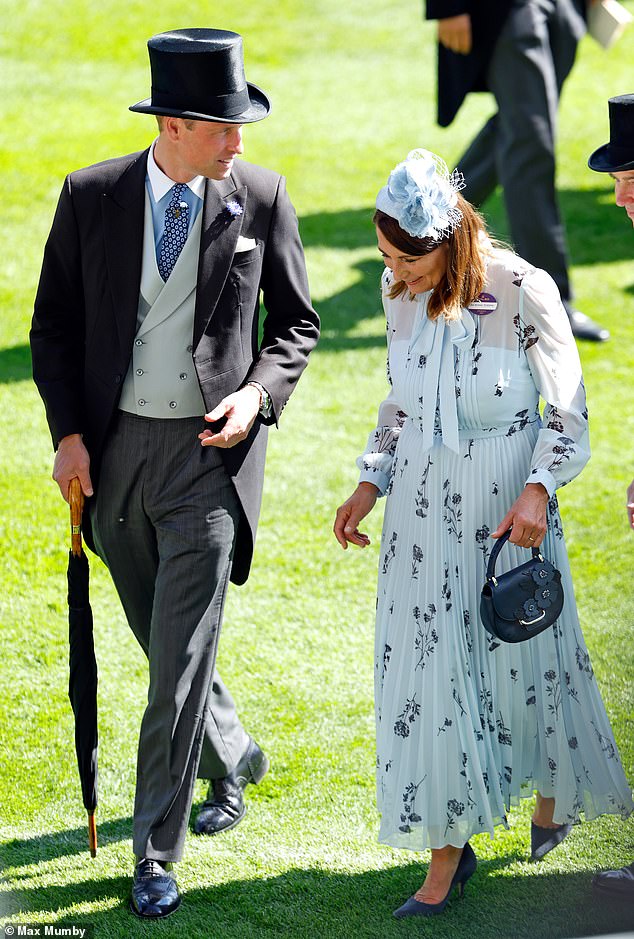 Prince William is pictured with his mother-in-law Carole Middleton as the two attend Royal Ascot together today
