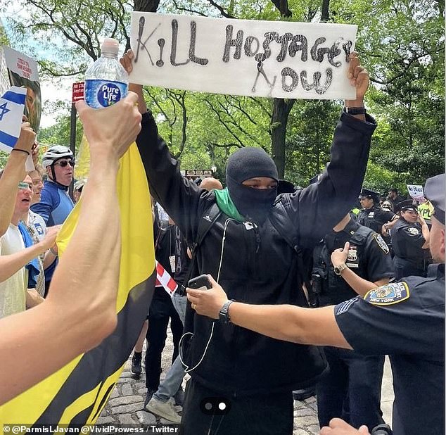 The anti-Israel protester held up the disgusting sign during the annual Fifth Avenue Israel Day Parade on Sunday