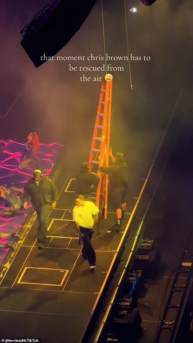 The 35-year-old singer is seen hanging above the stage during a performance at the Prudential Center in New Jersey on Wednesday, according to the clip shared by @terriem89