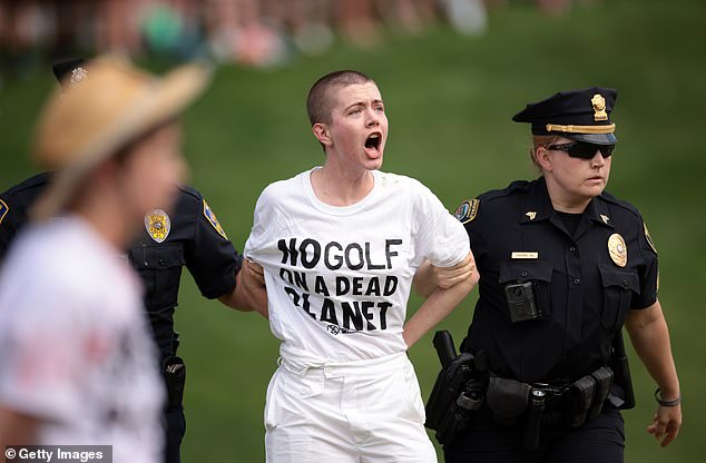 Protesters stormed the 18th green during the final round of the Travelers Championship