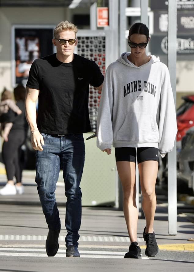 Cody Simpson enjoyed a romantic stroll with girlfriend Emma McKeon on the Gold Coast on Tuesday before flying to Paris for the Olympics