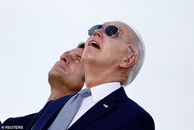 US President Joe Biden and French President Emmanuel Macron look on during a flag ceremony on the first day of the G7 summit in Savelletri, Italy, June 13