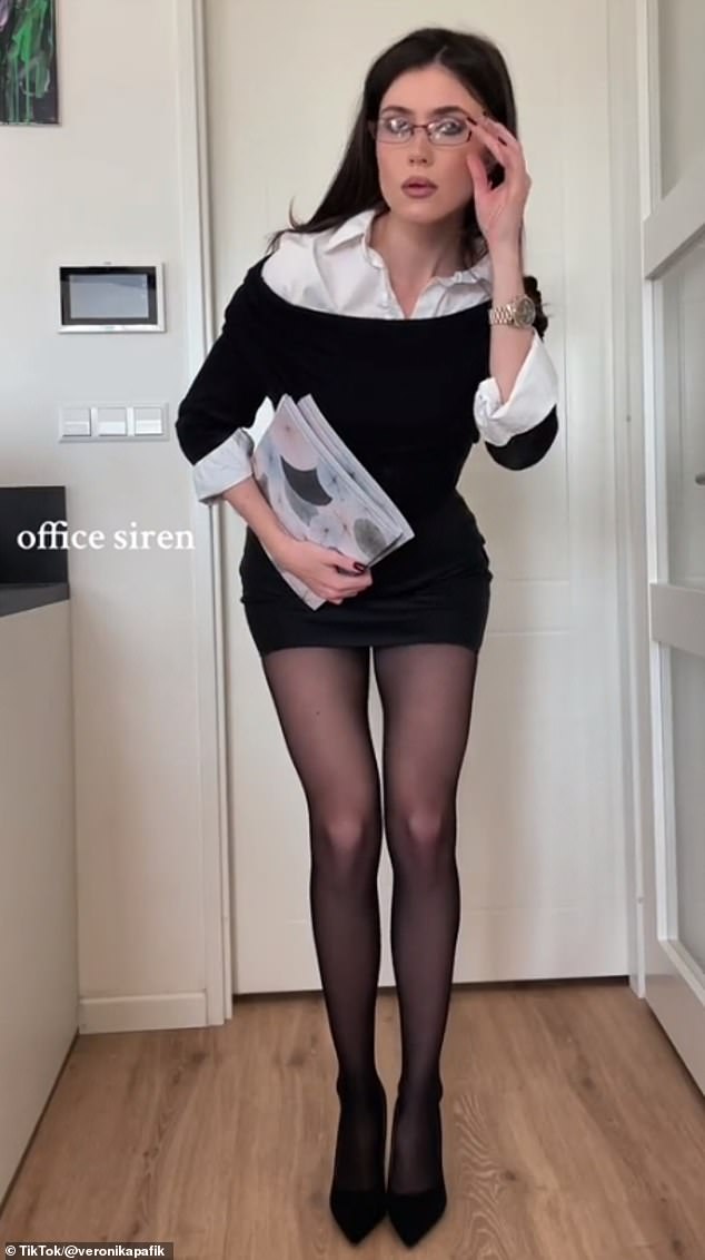 Gen Z have shared their take on workwear, including influencer Veronika Pafik (pictured), but critics have labeled the 'office siren' look inappropriate