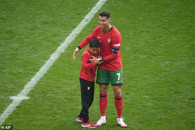 Cristiano Ronaldo made a young child's dream come true after pausing to take a photo with a fan during Portugal's match against Turkey