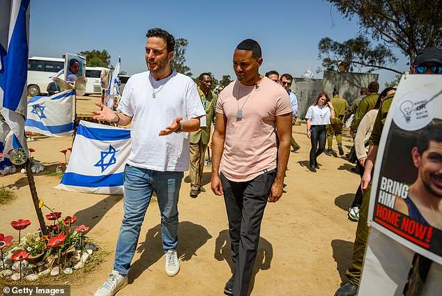 Rep. Ritchie Torres, DN.Y., (right) visits the site of the Nova Festival massacre with a survivor of the attack