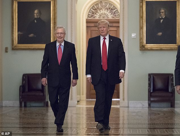 Former President Donald Trump, accompanied by Senate Majority Leader Mitch McConnell, R-Ky.  when he arrives on Capitol Hill on October 24, 2017.  The two were friends during Trump's presidential term and worked closely to get legislation like Trump's tax reforms through Congress