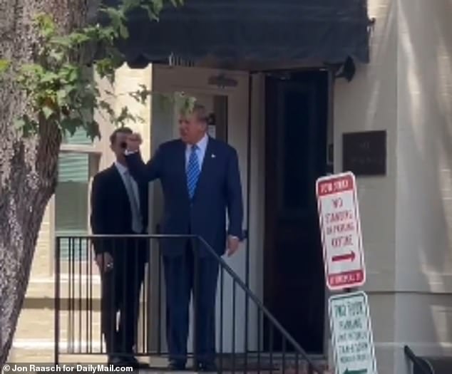 Donald Trump gives a fist pump to supporters after meeting with Senator Mitch McConnell and the Senate Republican Conference.  It was the first time he had spoken to McConnell in years