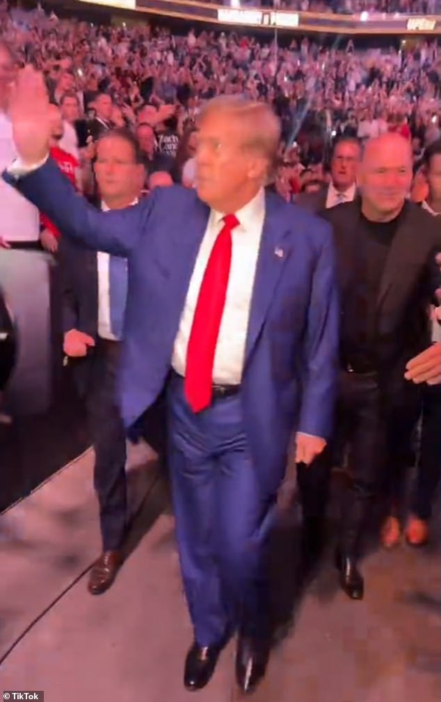 The flashy launch video showed Trump entering the arena, waving to fans and posing for selfies