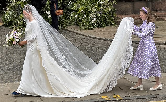 Olivia Henson looked the picture of a beautiful bride as she arrived at Chester Cathedral this morning to marry her groom, the Duke of Westminster.