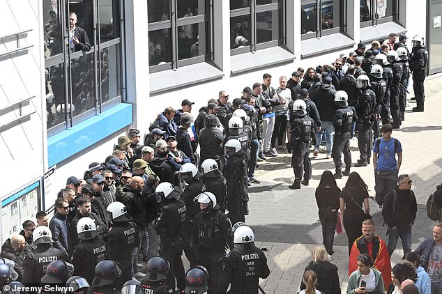 Police surround the Albanian Ultras in central Dortmund before their match against Italy today