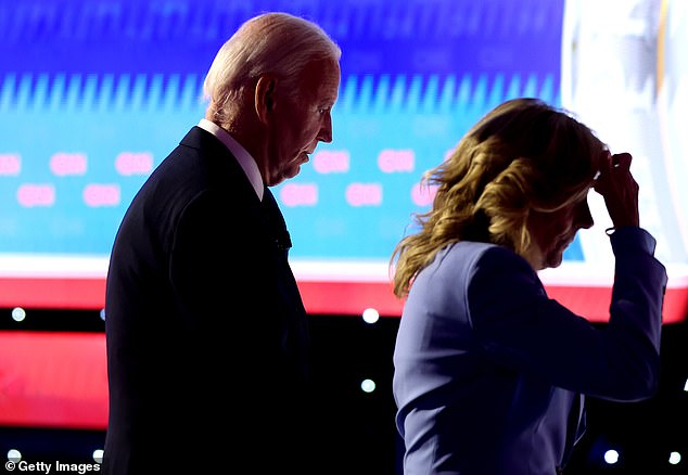 Joe Biden and Jill Biden are pictured leaving the debate stage in Atlanta, Georgia last night