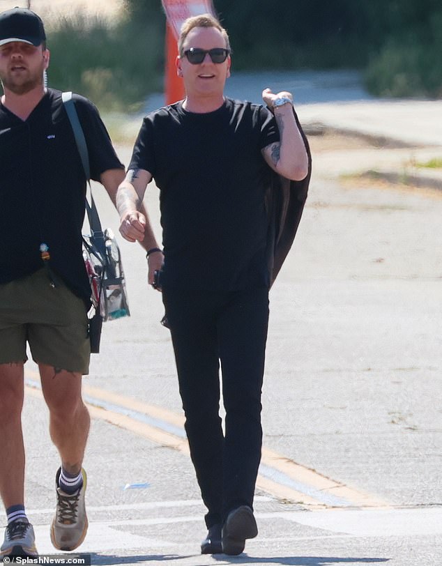 The two-time Emmy winner walked onto the set in Piru, CA wearing a black T-shirt and jeans with black boots