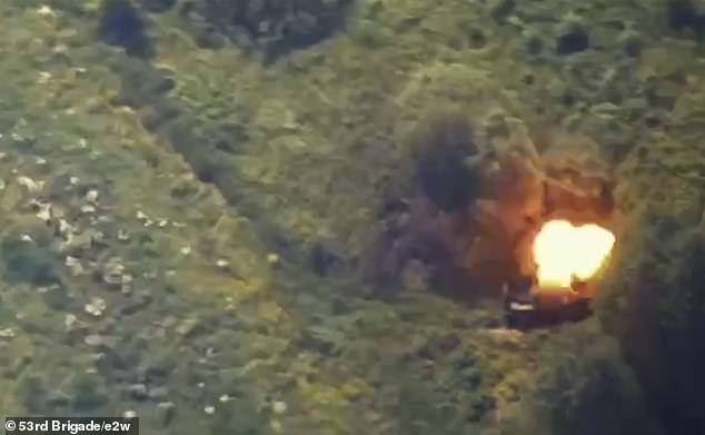 A military truck explodes when hit during the attack on the convoy