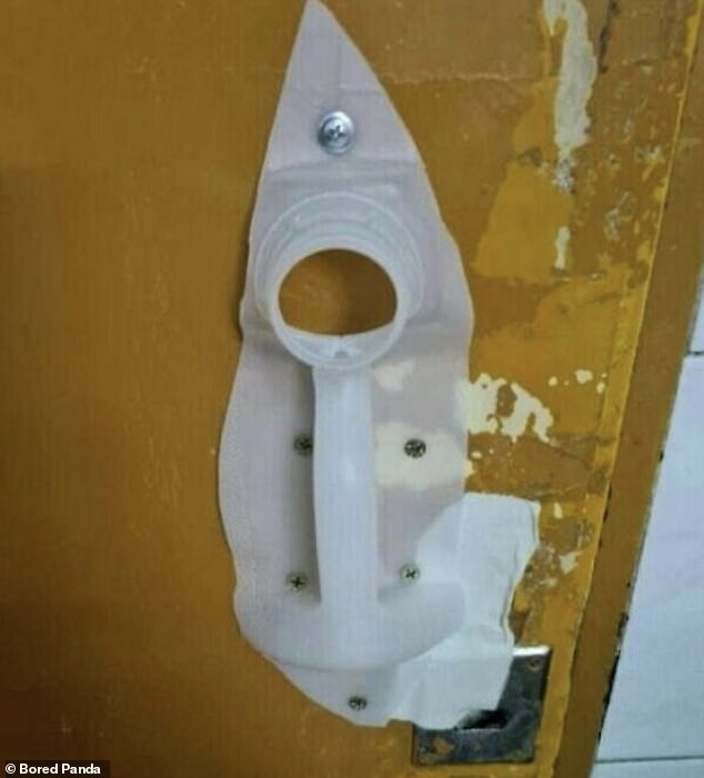 Sorted!  One creative person used the resources at his disposal to turn a milk carton into a door handle