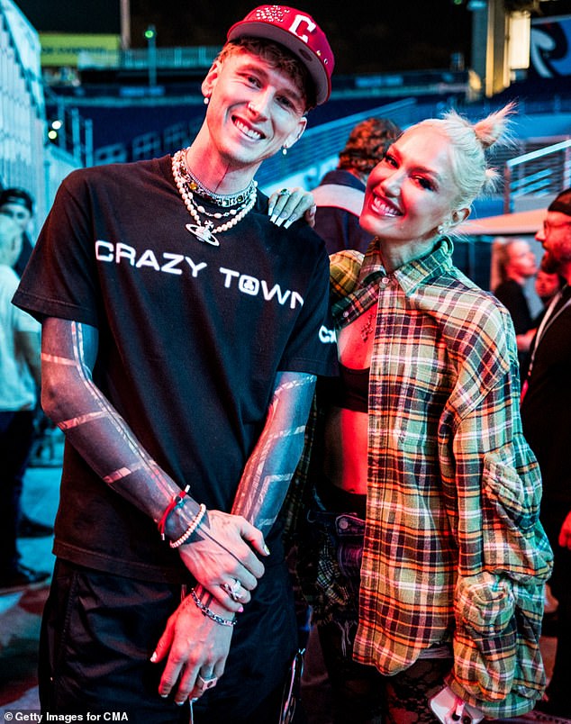 MGK, born Colson Baker, wore a black “Crazy Town” T-shirt and a red hat