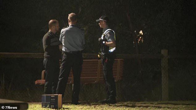 The unidentified body was found in a lake at Mawson Park in Hillarys, Perth's northern suburbs, about 4.30pm on Wednesday (pictured, officers on scene)