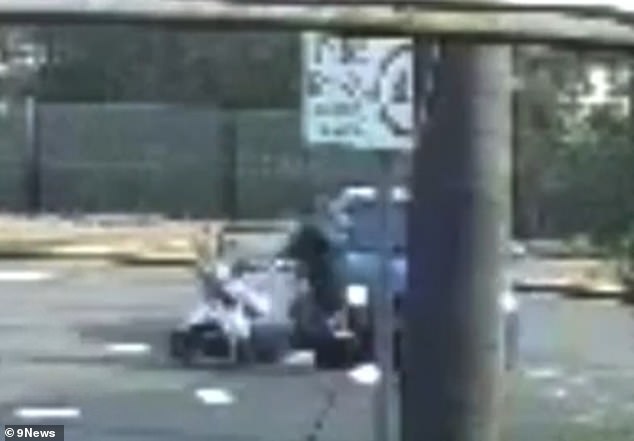 A shocking alleged collision (pictured) captured on CCTV Friday afternoon shows a mother pushing her baby in a stroller being hit by a car in Sydney's south-west