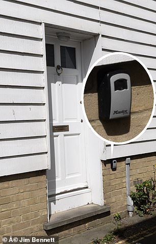 Key boxes on the doors of cottages in Whitstable indicate they are being used as Airbnb properties