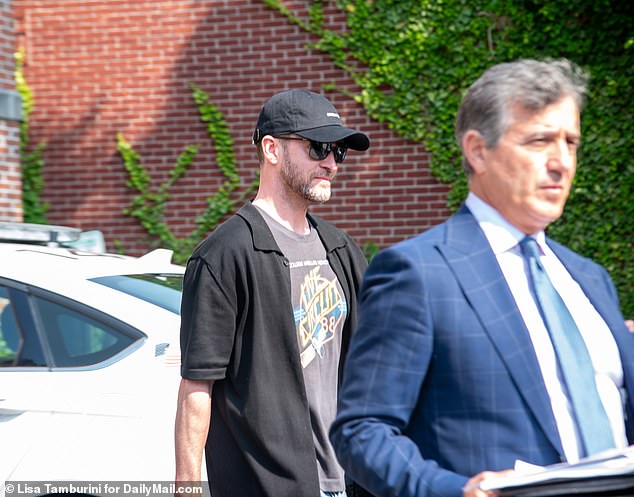 Justin Timberlake, 43, is escorted from the Sag Harbor courthouse by famed fix-it attorney Edward Burke Jr.