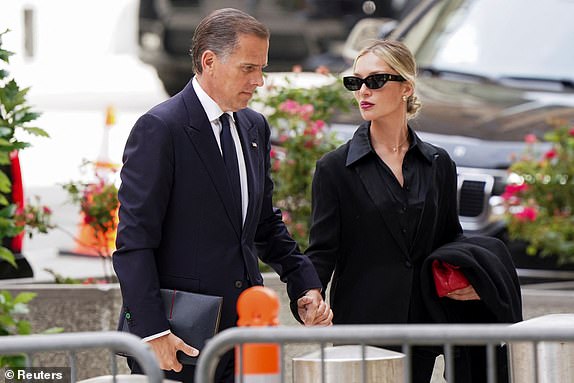 Hunter Biden, son of US President Joe Biden, and his wife Melissa Cohen Biden arrive at federal court during his trial on criminal weapons charges in Wilmington, Delaware, US, June 5, 2024. REUTERS/Kevin Lamarque