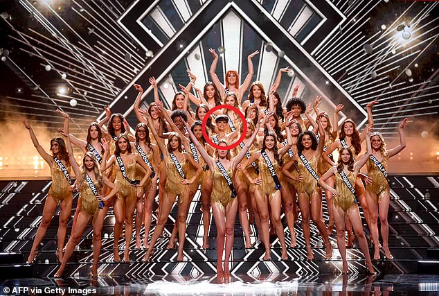 The Miss France contestants on stage wore matching bodysuits with gold tassels during the December 2023 final