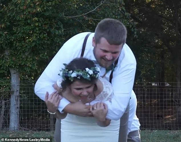 Blake and Mary Greenwell were posing for playful photos outside their wedding venue when the 6-foot-2 bride decided to carry her 6-foot-2 husband on her back