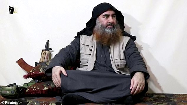 Caliphate leader: Abu Bakr al-Baghdadi detonated his own suicide vest during the targeted attack on his hideout in Syria's Idlib province, killing three of his children in the blast.  He is seen in a still from a video released in April 2019 and has not been seen since he spoke at the Grand Mosque in Mosul in 2014.