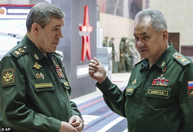 File image shows Russian Defense Minister Sergei Shoigu, right, talking to Russian Chief of the General Staff General Valery Gerasimov