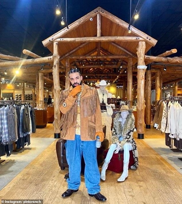 Drake wears a tassel coat at the Houston location, which opened in 2004