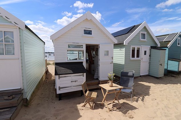 This beautiful beach hut, located on Mudeford Sandbank in Dorset, sold last year for an eye-watering £480,000, some £130,000 more than the average price of a UK house. Inside, it features a quirky interior, as pictured below, and a mezzanine sleeping area